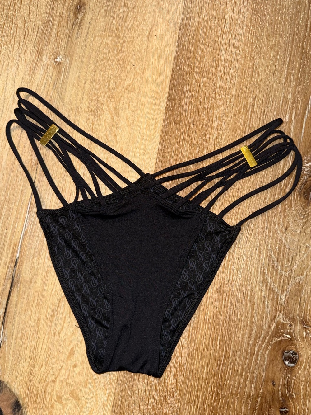 Black Strappy Women’s Bikini Bottom with Gold Accents - Size Medium